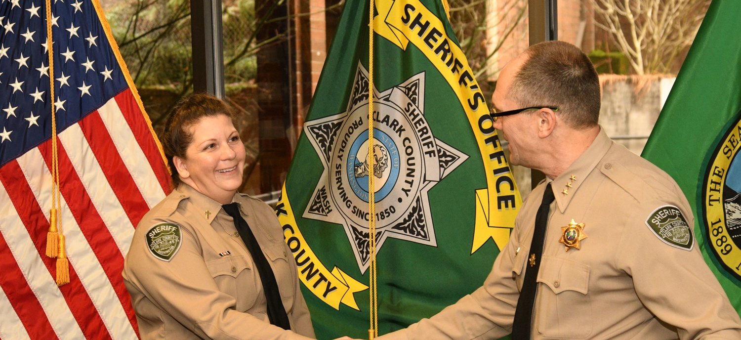 Newly sworn-in Clark County Sheriff’s Office Chaplain Cari Arnsparger shakes Sheriff John Horch’s hand following a ceremony that officially made her a part of the department on Jan. 4.