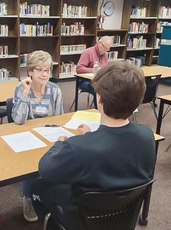 Gail Haskett, of the Lewis River Rotary Club, conducts a mock interview with a Battle Ground High School student on Monday, Jan. 23.