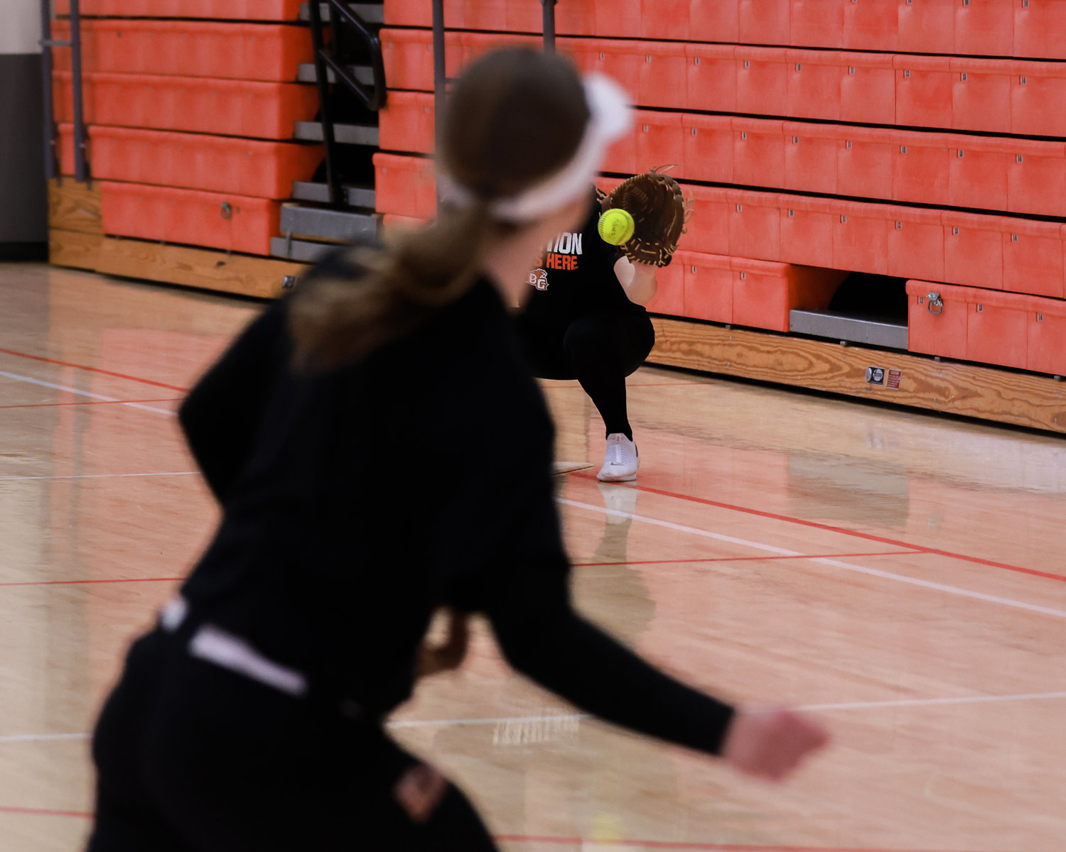 Indoor defense drills for softball are seen here at Battle Ground High School due to field conditions on Tuesday, March 7.