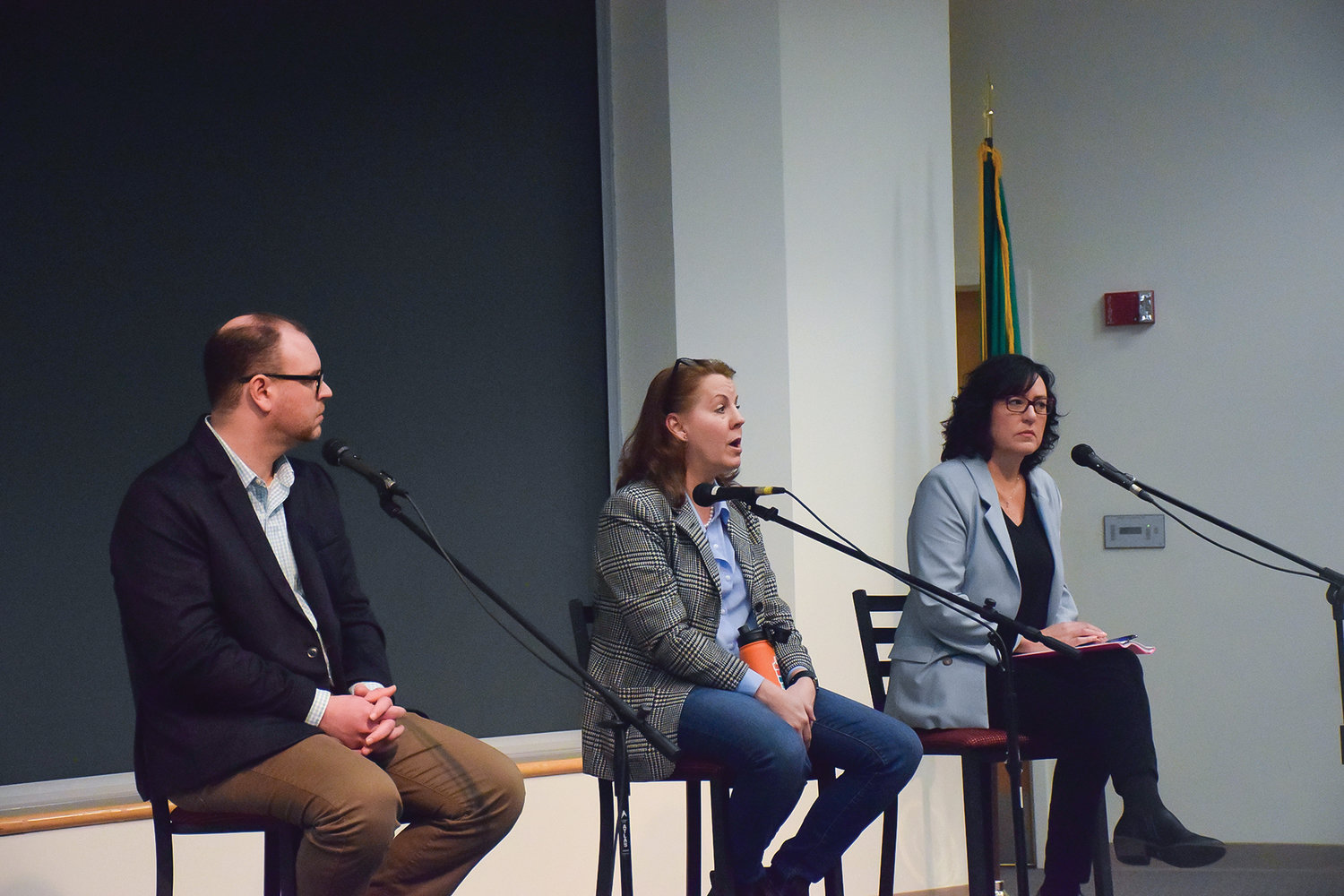 From left, Washington state Rep. Greg Cheney, state Sen. Ann Rivers, and state Rep. Stephanie McClintock take questions from constituents at a town hall meeting at Washington State University Vancouver on March 11.