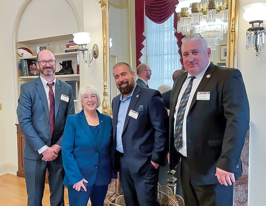Left to right, Battle Ground city councilor Troy McCoy, U.S. Sen. Patty Murray, and city councilors Adrian Cortes and Shane Bowman pose for a photo in Washington, D.C.