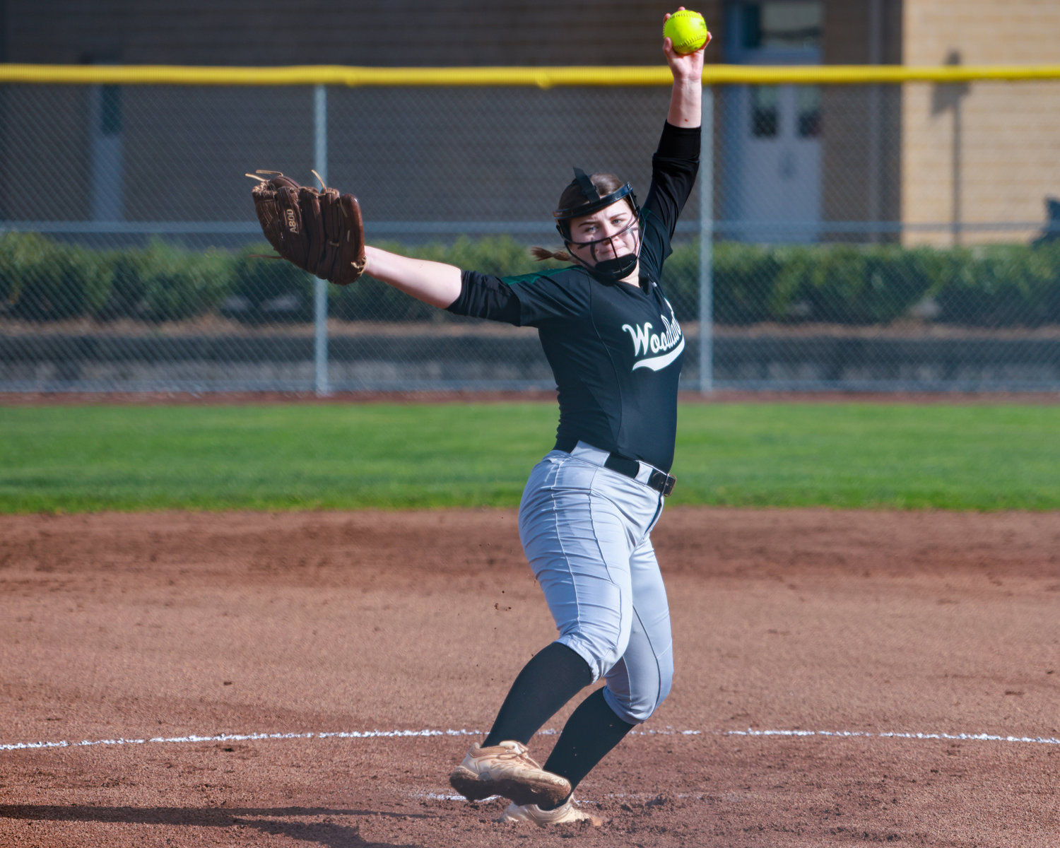 Gracelynn Huffman, Woodland's starting pitcher, winds up a pitch during Woodland's loss to Kelso on Wednesday, March 29.