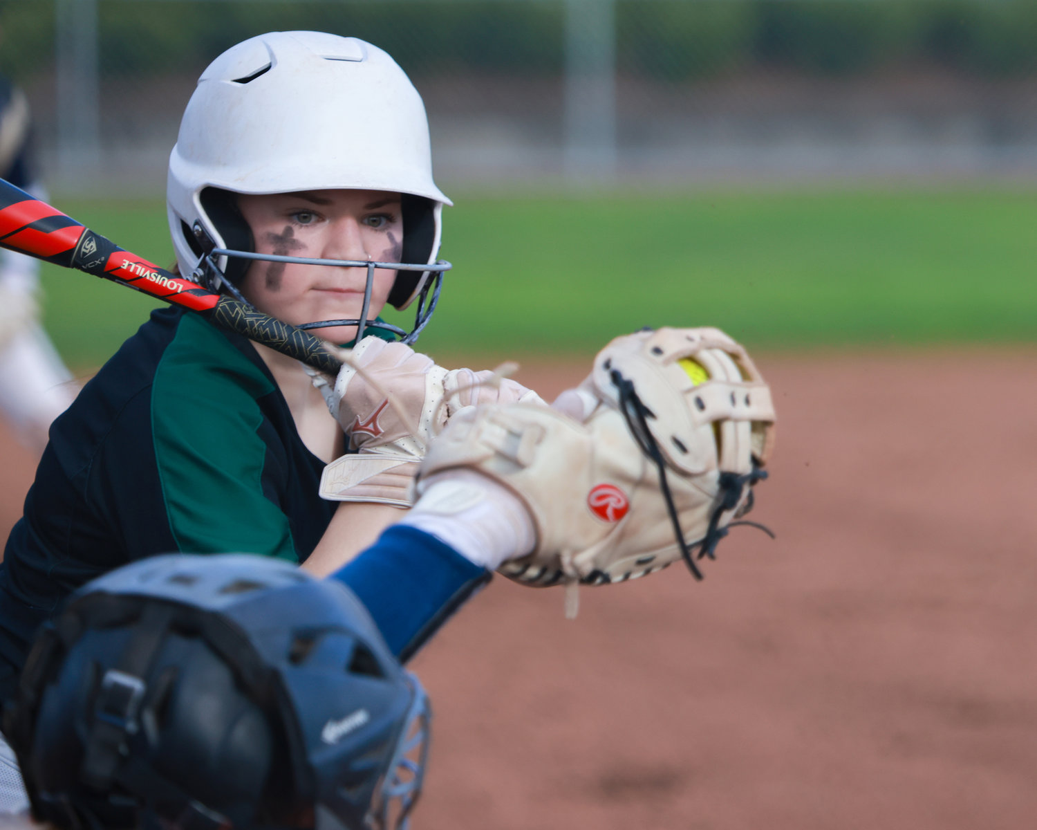 Woodland's Gabi Silveria watches a pitch as it goes into the catcher's glove during a game against Kelso on Wednesday, March 29.