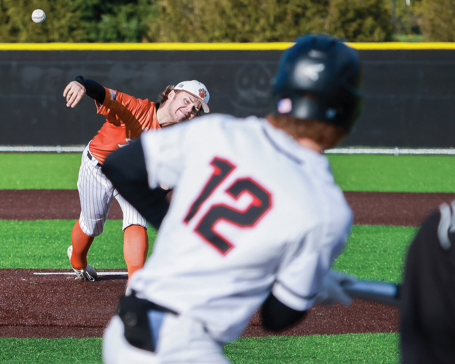 Battle Ground's Ty Linster throws a pitch resulting in a strike during the team's game one loss against Camas on Tuesday, April 11.