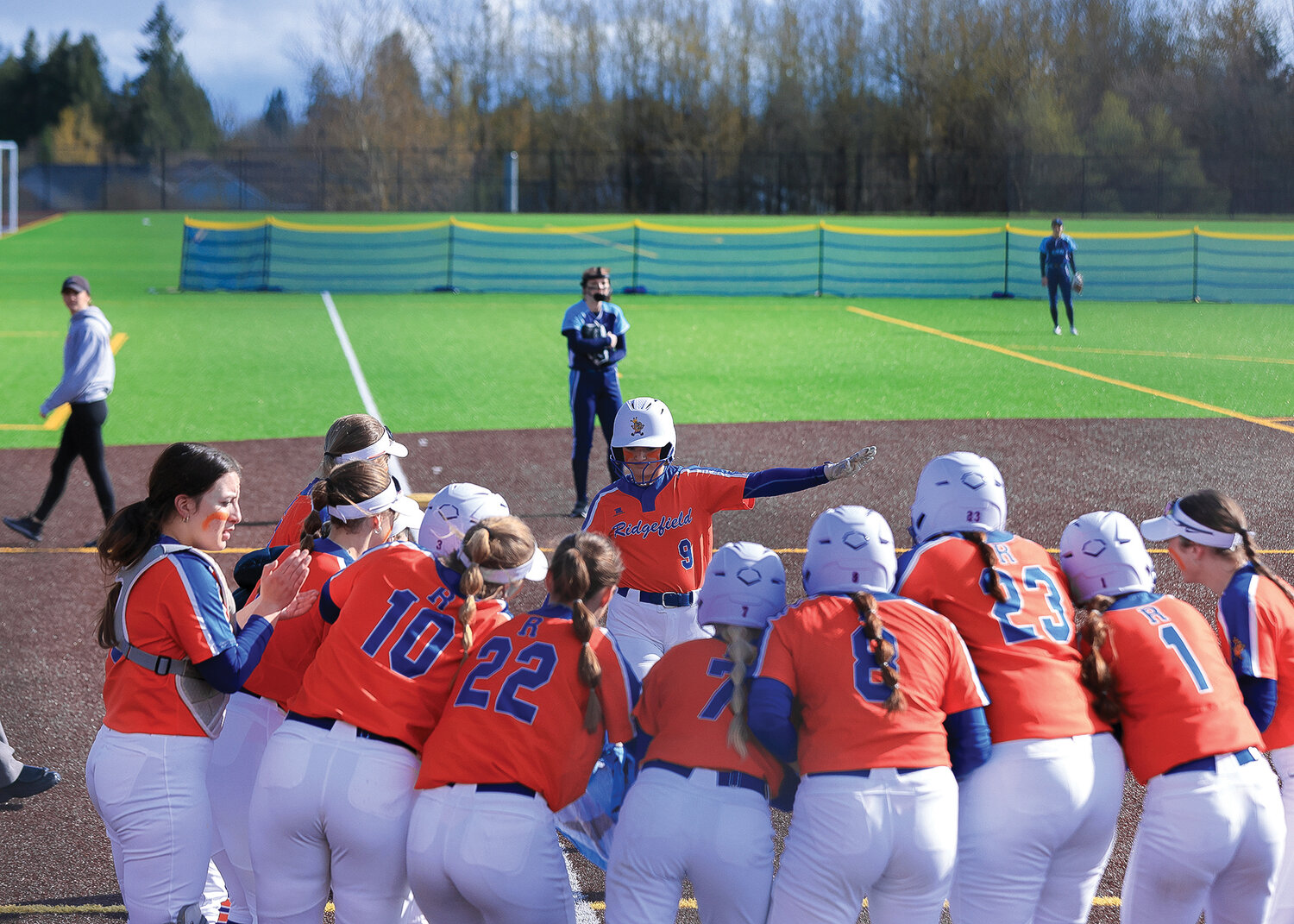 Ridgefield senior Madeline Smith flies into home after she launched a home run that scored three in the first inning during the Spudders' win over Hockinson on Wednesday, April 19.