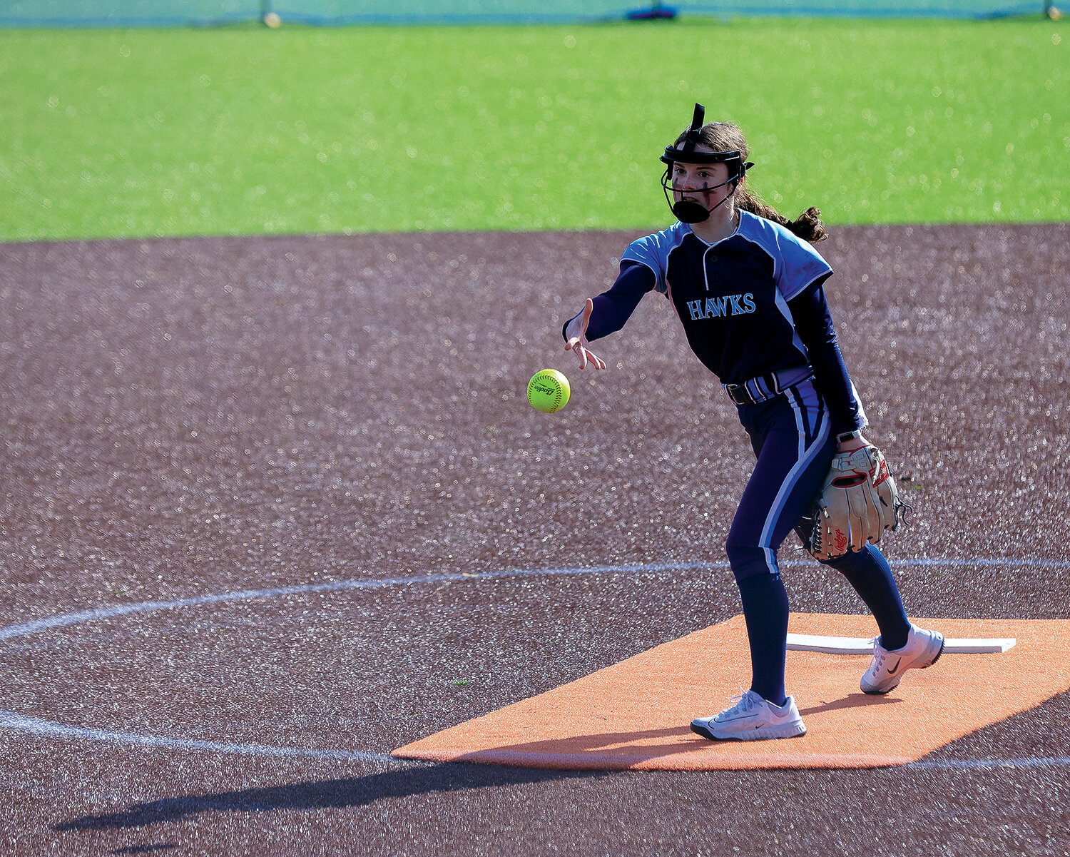 Freshman Lily Ritton makes a pitch for Hockinson during a game against Ridgefield on Wednesday, April 19.
