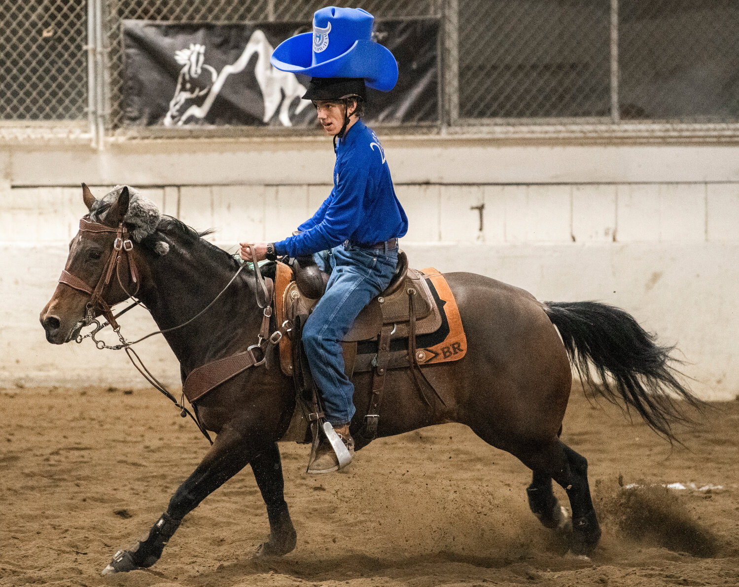 Hockinson’s Braden Roth sports a big cowboy hat in a fast-paced performance in Tacoma on Saturday, April 15 for the team’s final district meet of the season.