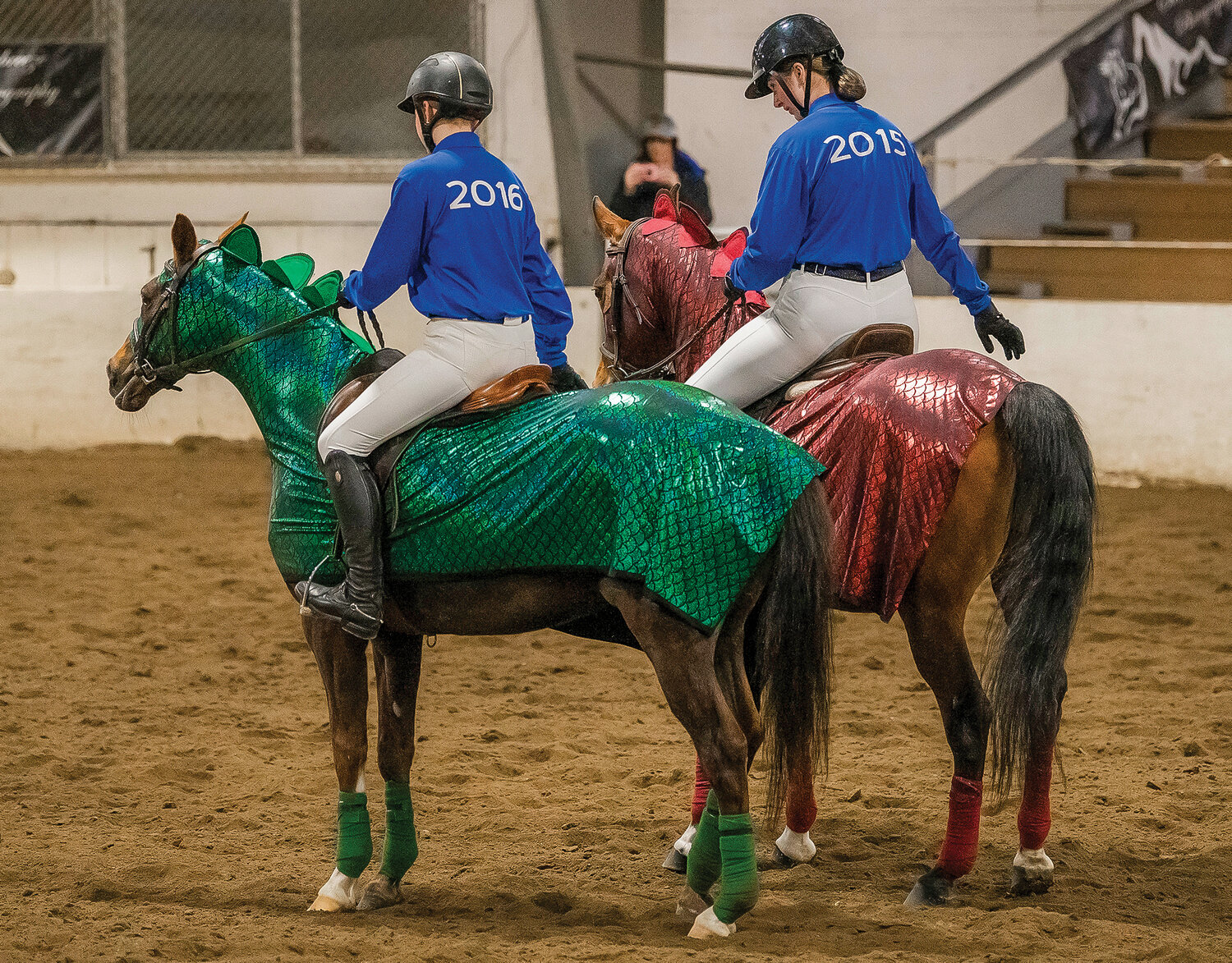 Hockinson equestrians Evelyn Vossler (2016) and Brooklynn Slaby salute the judges after a performance in Tacoma on Saturday, April 15 for the team’s final district meet of the season.