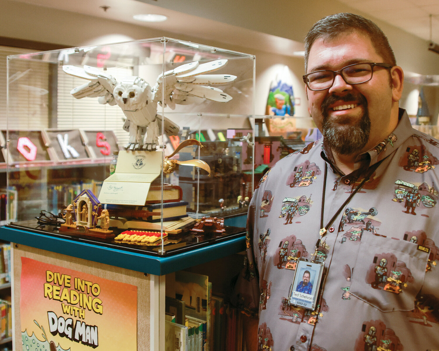 Captain Strong Primary School librarian Ted Schelvan stands with his personal favorite Lego set, Harry Potter, Hedwig The Owl Figure, on Wednesday, May 3.
