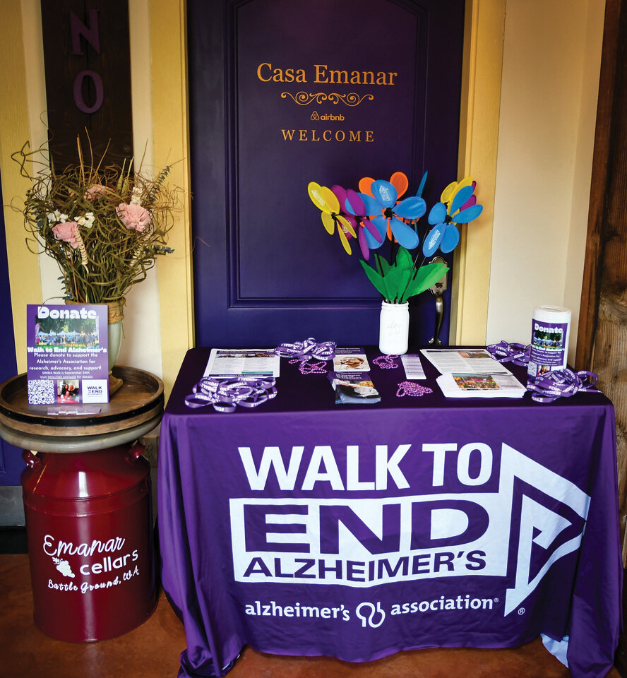 The information table at Emanar Cellars sits on display on May 2 during a kickoff event where 
the wine bar announced it 
will be open 
on Tuesdays and will donate 10% of their sales on that day of the week to the Walk to End Alzheimer’s.