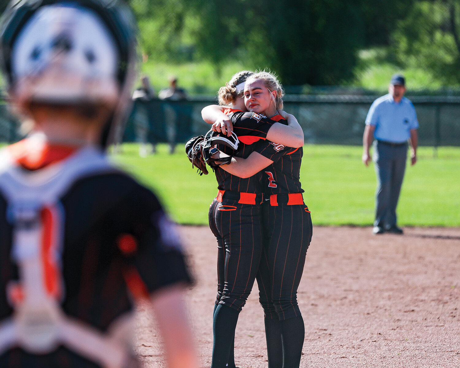 Senior Rylee 
Rehbein, right, 
and Hailey Ferguson, left, embrace 
as Rehbein receives a curtain call on 
senior night at Battle Ground High School during a 12-0 victory over Mountain View on Wednesday, 
May 10.