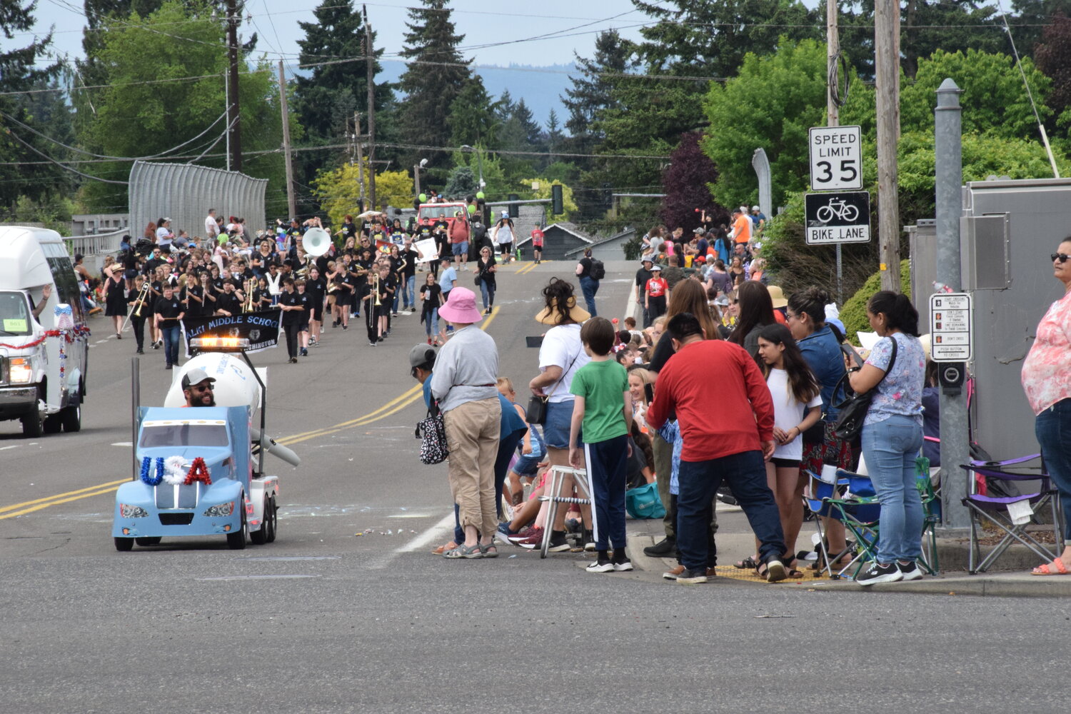 A miniature cement truck dispenses candy to paradegoers at the 2023 Hazel Dell Parade of Bands on May 20.