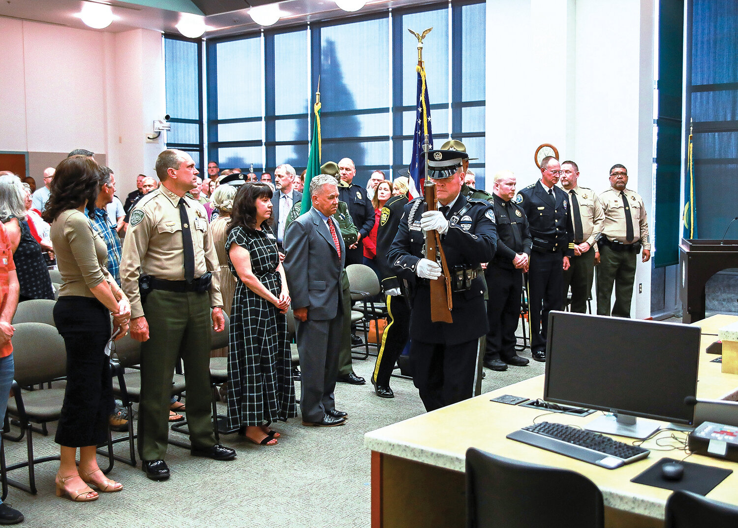 The Honor Guard posts the colors to kick off the Clark County Law Enforcement Memorial Ceremony in the hearing room  of the Public Service Center in Vancouver on Thursday, May 18.