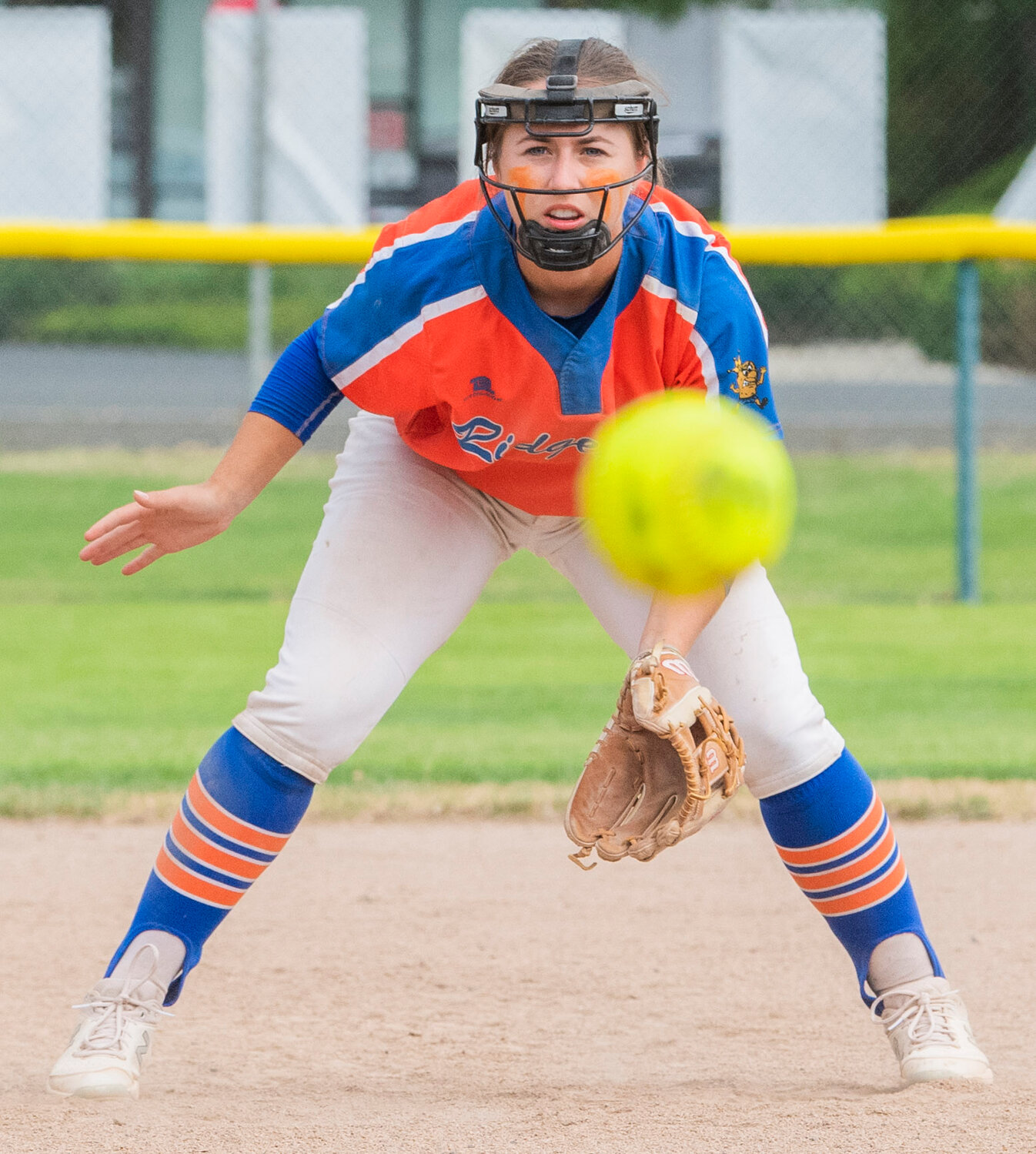 Ridgefield’s Madison Walker (22) eyes down a ground ball during a state title game against North Kitsap at Carlon Park in Selah on Saturday, May 27.