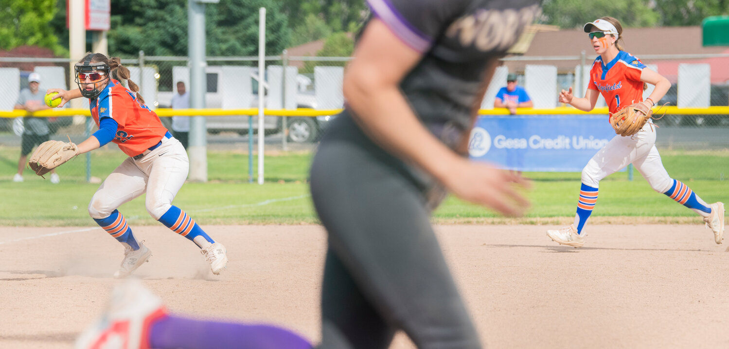 Ridgefield’s Madison Walker (22) looks to make an out during a state title game against North Kitsap at Carlon Park in Selah on Saturday, May 27.
