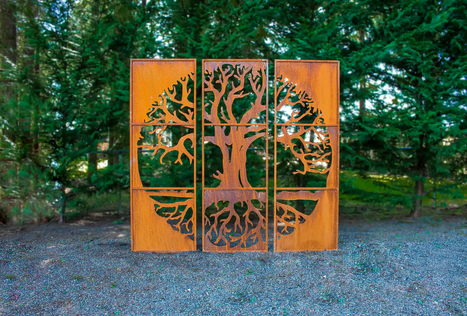 The tree of life design is displayed on a three piece six-foot-by-two-foot steel privacy screen.