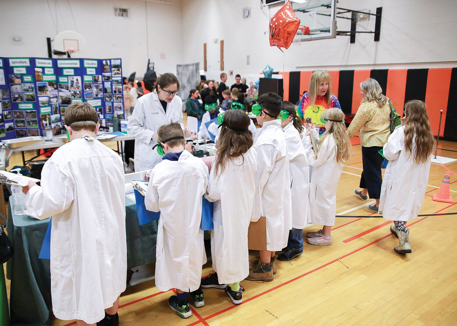 Students take part in an activity at the CASEE Center’s table during the fourth grade career fair at Battle Ground High School on Tuesday, May 30.