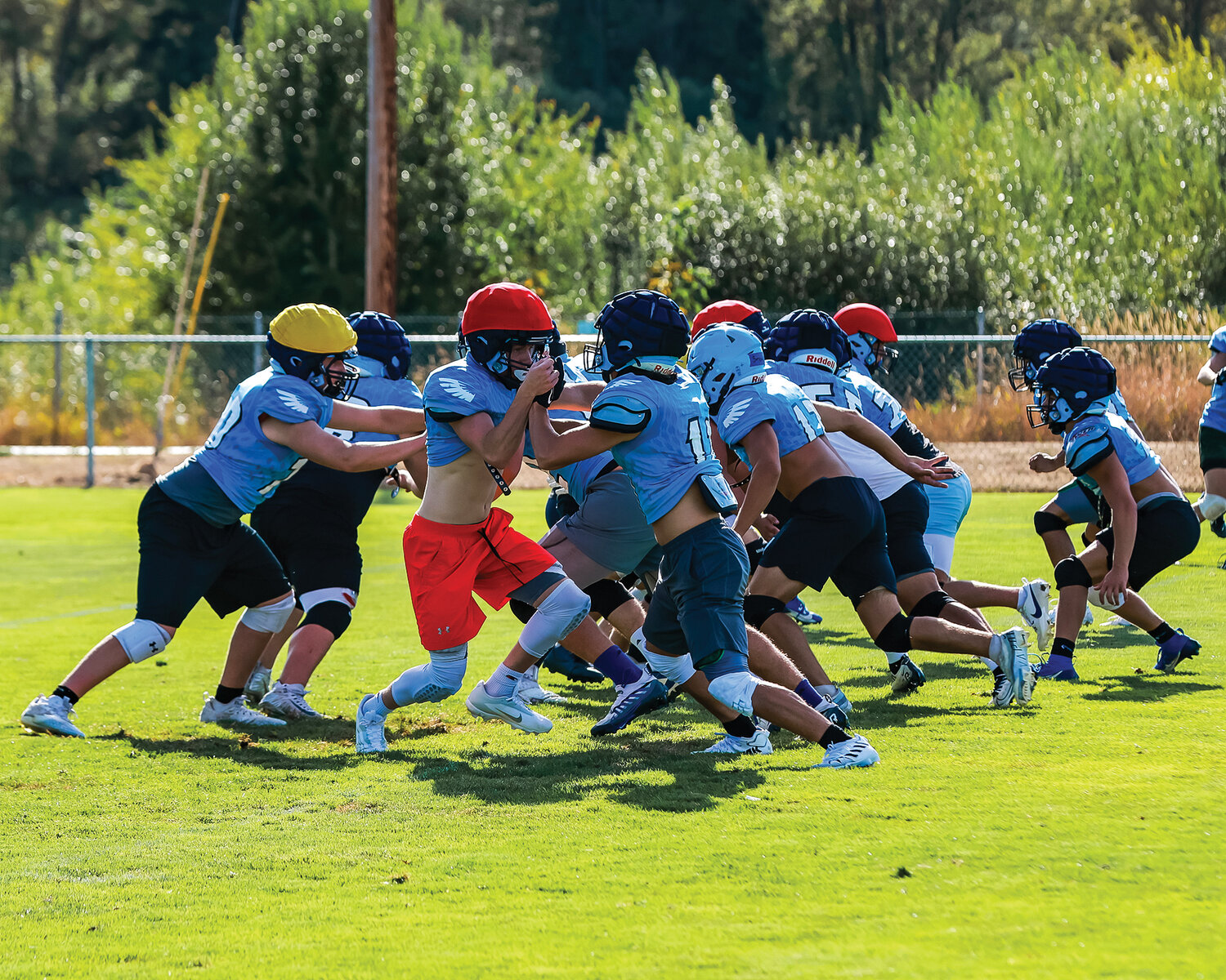 The trenches of the Hockinson Hawks go full speed in a practice on Monday, Aug. 21.