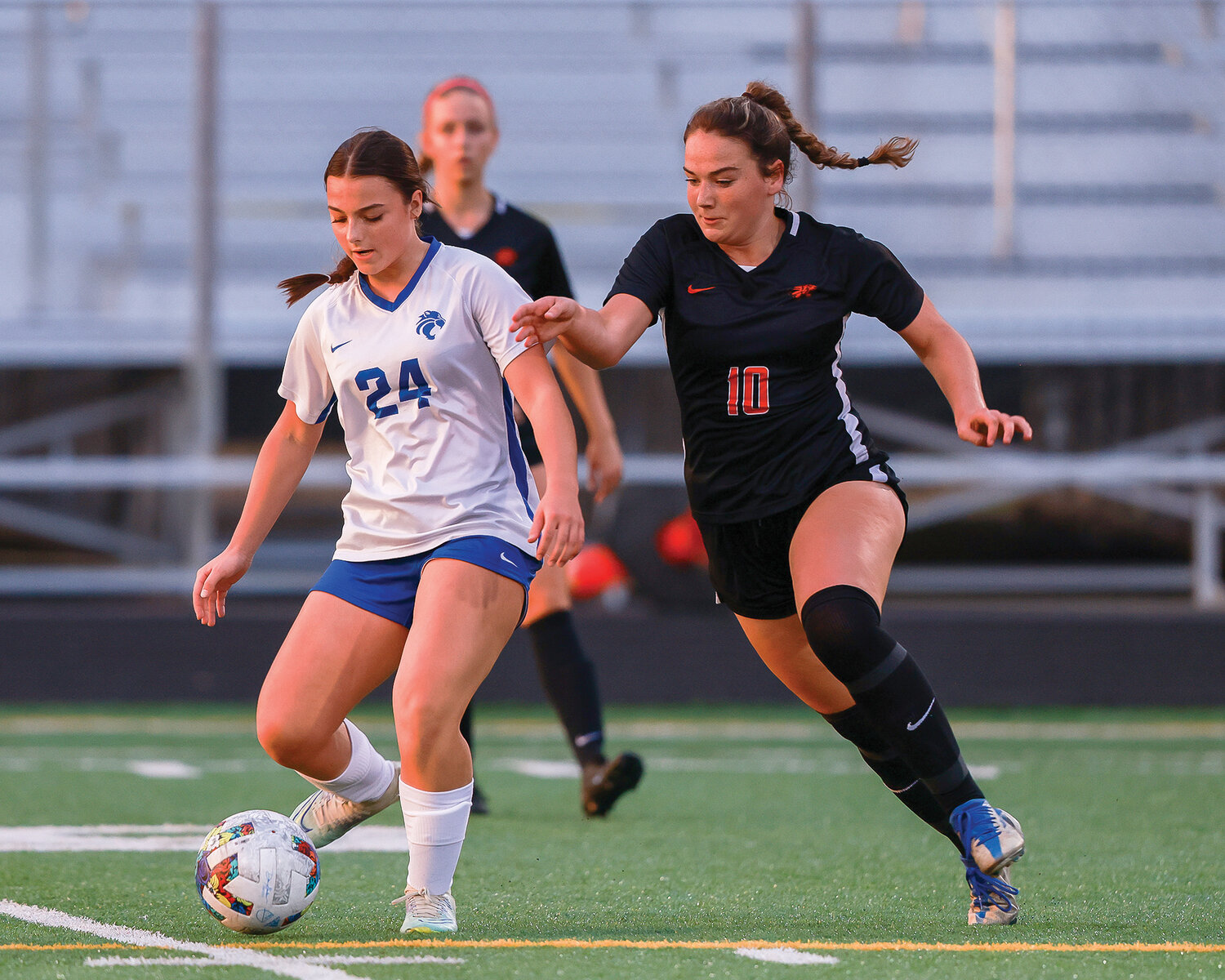 Battle Ground sophomore Avery Reese defends La Center sophomore Briley Vanderhoef during the Tigers’ 1-0 win over La Center on Tuesday, Sept. 12.