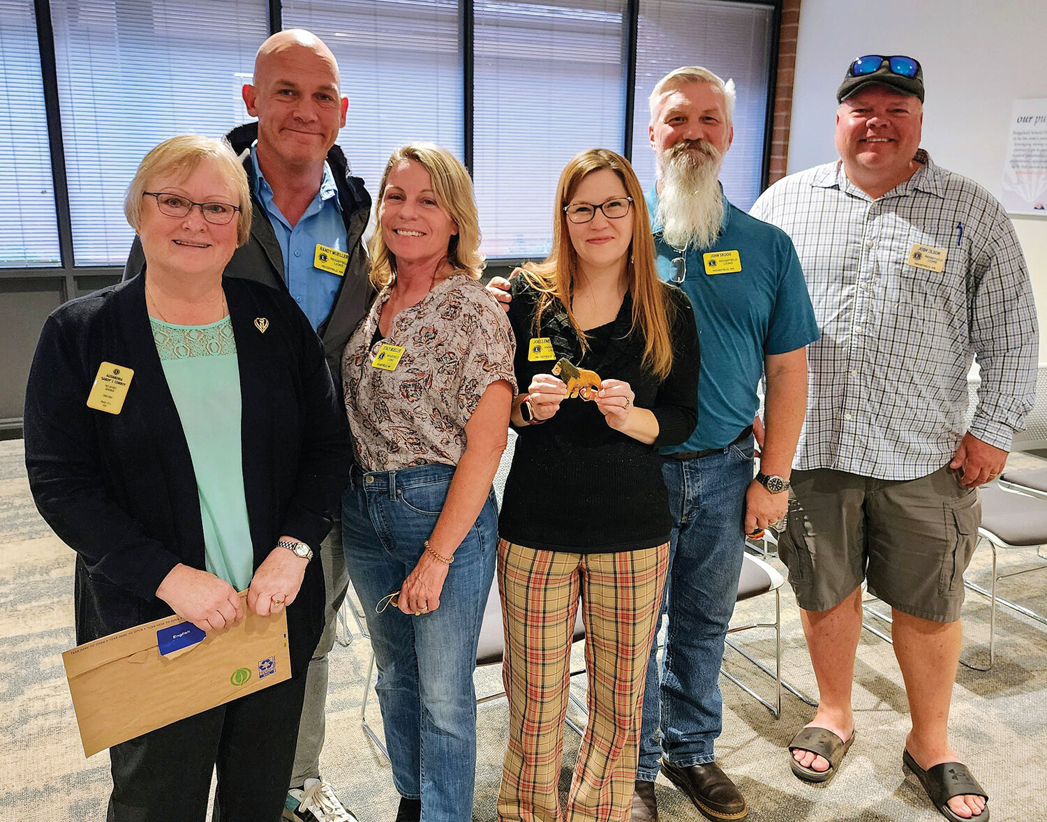 Sandy Conroy, far left, inducted four new individuals into the Ridgefield Lions on Sept. 28. They are, left to right: Randy Mueller; Stacy Mueller; Joellene Skoog; and John Skoog. At far right is Ridgefield Lions President John Olson.