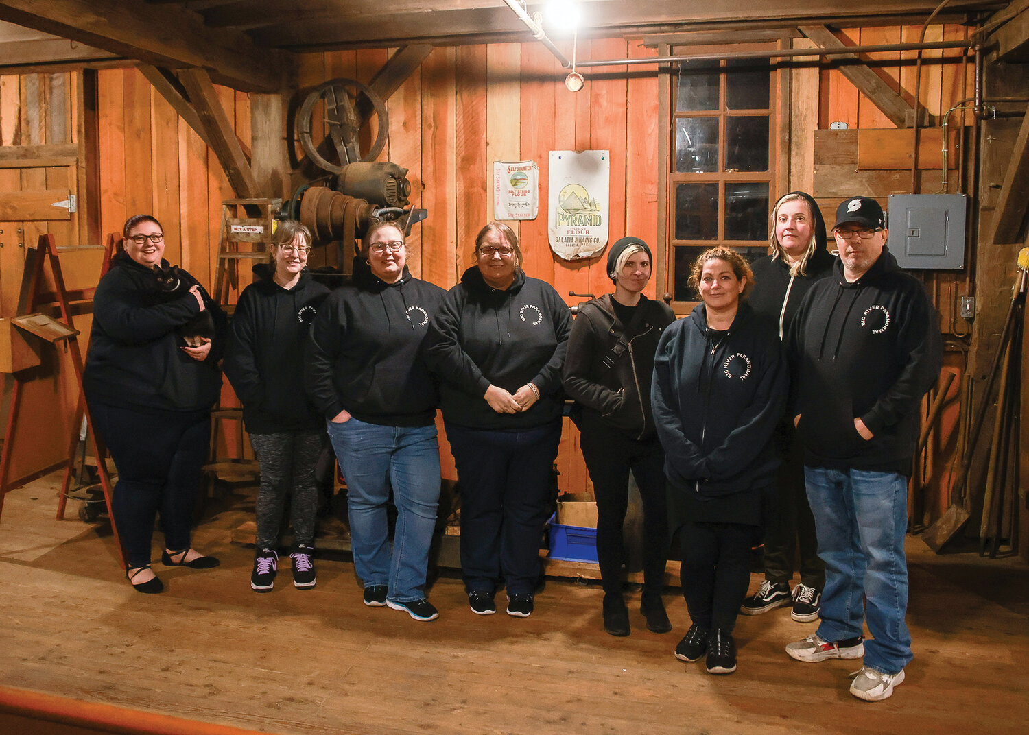 The Big River Paranormal team that investigated the Cedar Creek Grist Mill stands together after the investigation from the night of Saturday, Oct. 14 to the early morning of Sunday, Oct. 15. From left to right, Mariah Taasevigen, Kasey Breuier, Erin Nielsen, Barbara Flock, Rina James, Stacy       Rogers, Sommer Carter, Jason Hassler.