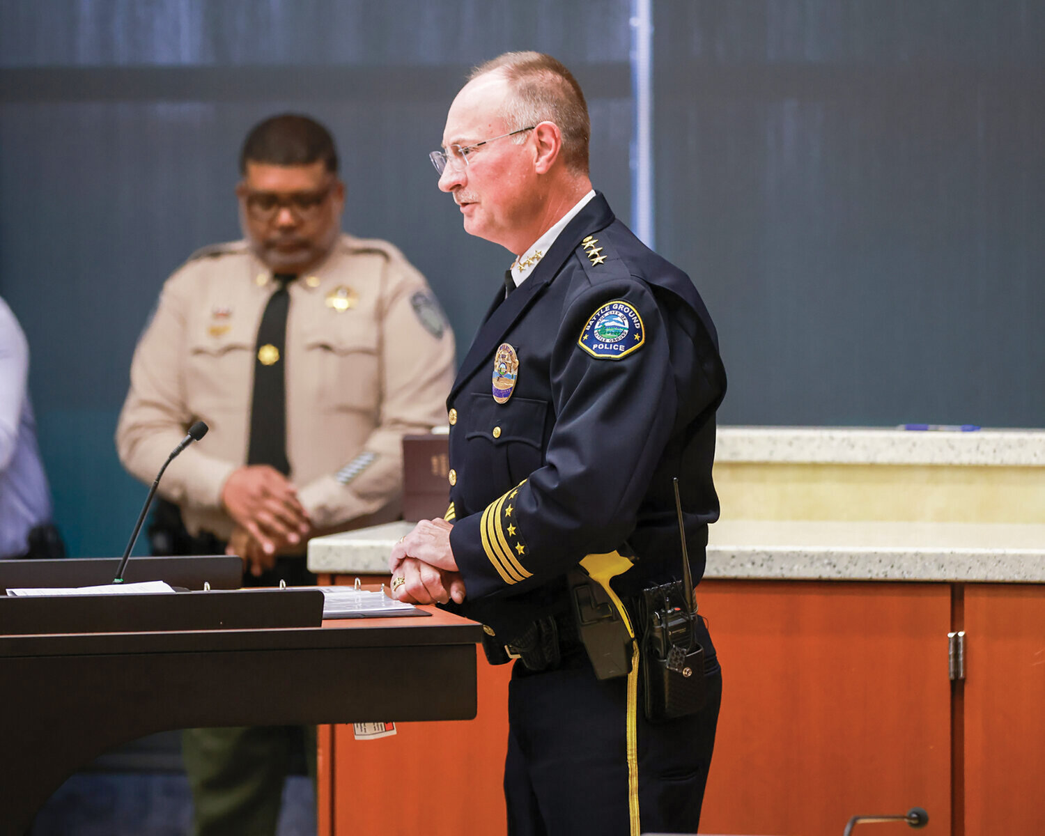 Battle Ground Police Chief Mike Fort reads the "roll call of honor" during the Clark County Law Enforcement Memorial Ceremony at the Public Service Center in Vancouver on Thursday, May 18.