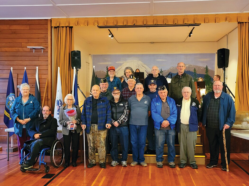 Veterans stand together at last year’s Amboy veterans celebration.