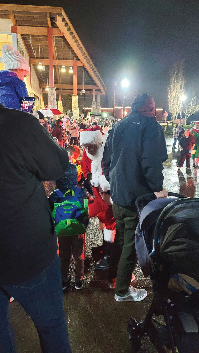 Santa Claus meets with kids at the Battle Ground Community Center during the tree-lighting ceremony on Friday, Dec. 1. 