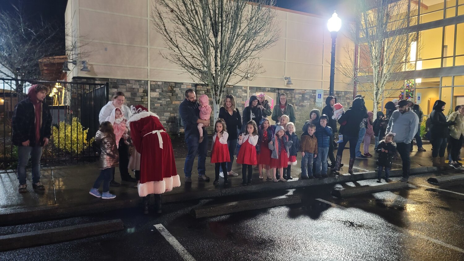 Kids line up and chant for Mrs. Claus during the tree-lighting ceremony at the Battle Ground Community Center on Friday, Dec. 1. 