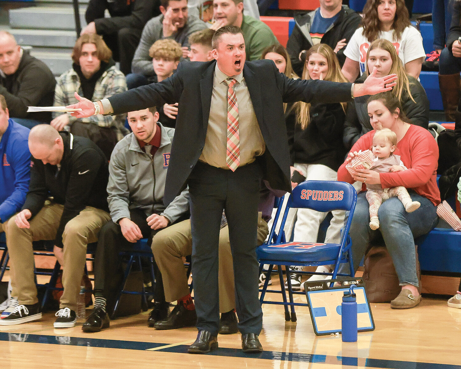 Ridgefield Spudders head coach Jason Buffum disagrees with a call during his team’s 56-39 win against the Fort Vancouver Trappers on Wednesday, Jan. 9.