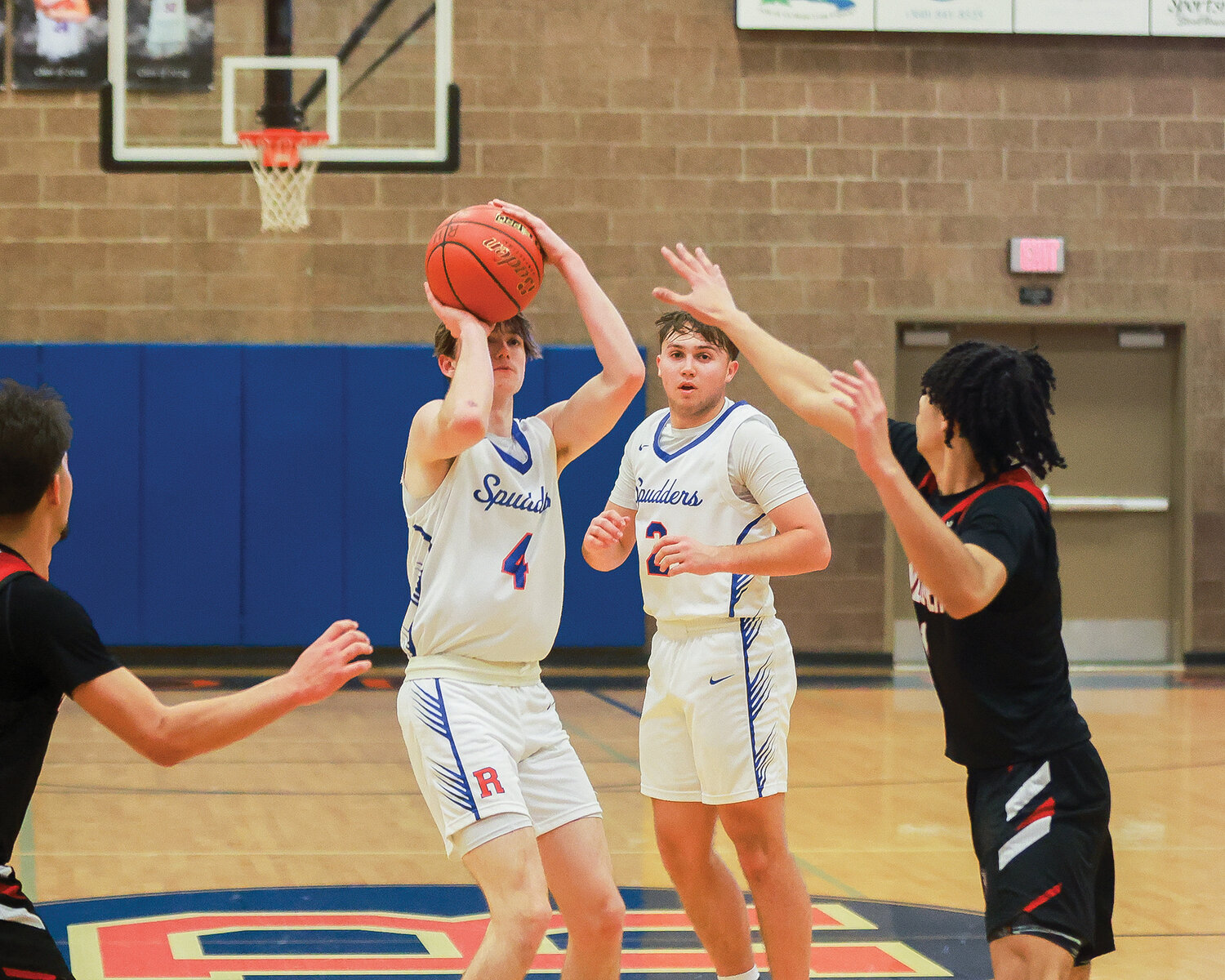 Ridgefield guard Cole Chester shoots a 3 during his game-leading 28-point performance in the 56-39 win over the Fort Vancouver Trappers on Wednesday, Jan. 9.