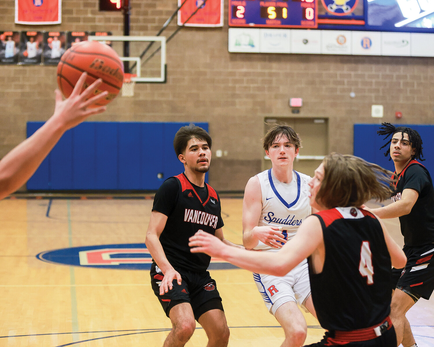 Ridgefield guard Cole Chester passes the ball in the lane during the Spudders’ 56-39 win over the Fort Vancouver Trappers on Wednesday, Jan. 9.