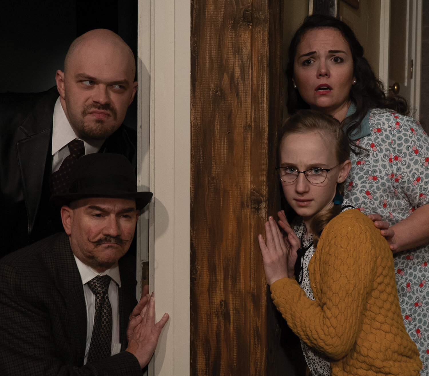 As the climax builds, con men Roat, played by Henry Lorch, and Carlino, played by Tony Provenzola, quietly wait on Susan, played by Kristen Bennett, and Gloria, played by Amelia Benson, in “Wait Until Dark,” being performed by Love Street Playhouse.