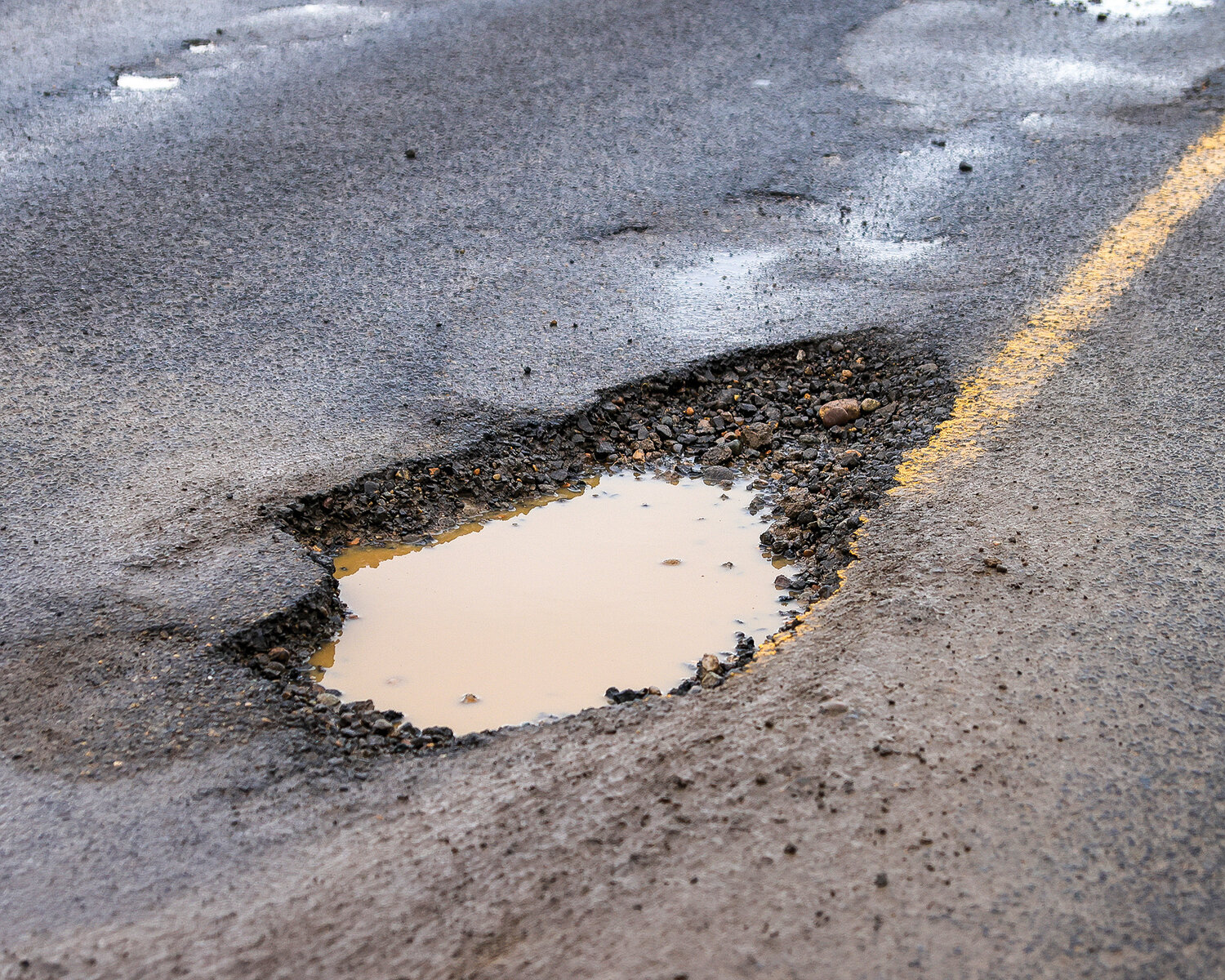 Kelly Melroy, facilities supervisor for the city of Ridgefield, said the amount of potholes fixed after the recent storms was normal when compared to previous winter weather events. These potholes were located on Northeast 279th Street in Ridgefield.