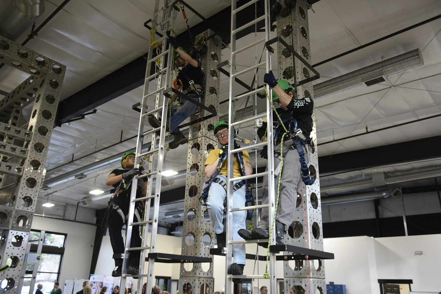 Students from Northwest Renewable Energy Institute practice climbing for high elevation wind turbine repairs and emergency rescues.