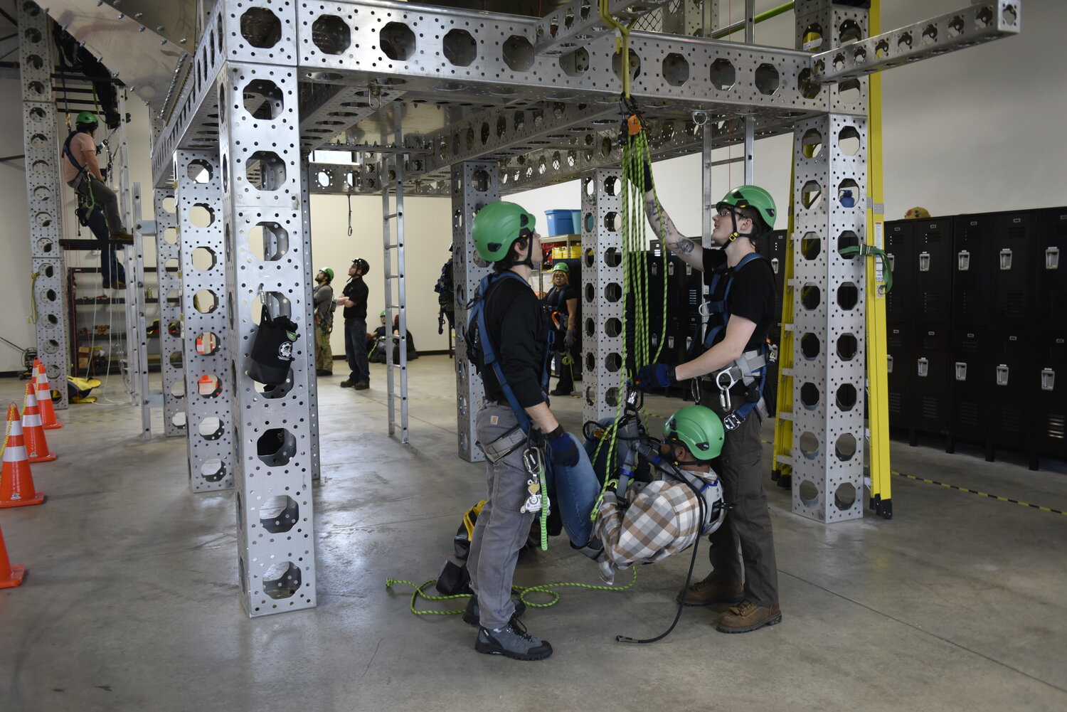 Students from Northwest Renewable Energy Institute are required to practice proper use of harness equipment for wind turbine climbing and repairs.