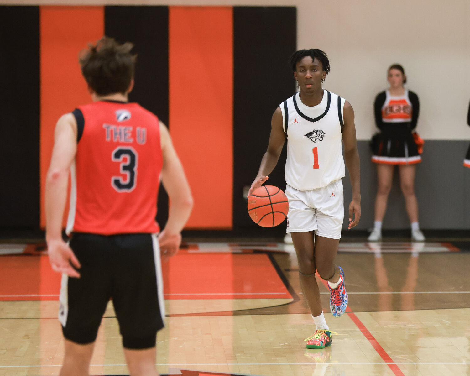 Senior Derick Amanor moves the basketball up the floor on Tuesday, Jan. 30 in the Tigers’ 55-35 loss to the Union Titans.